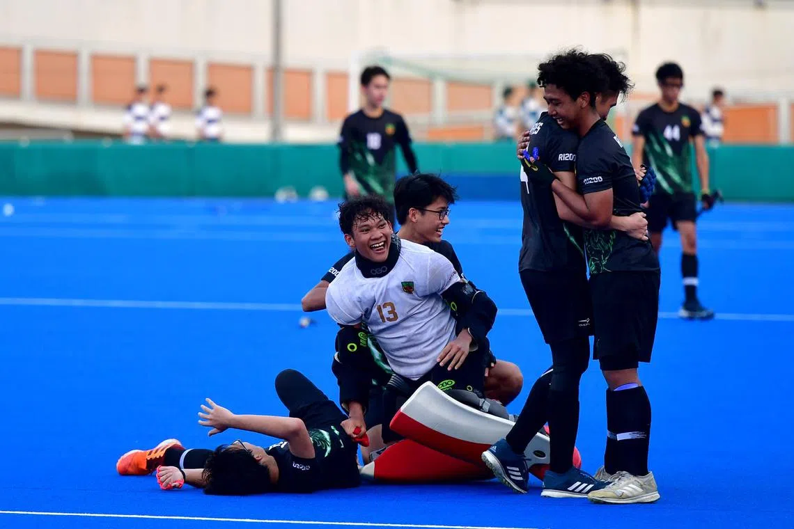 Raffles Institution players celebrating at the final whistle after a commanding 4-0 win over rivals Victoria Junior College.