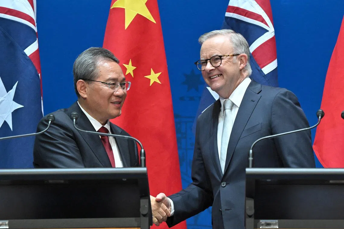 Australian Prime Minster Anthony Albanese (right) and his Chinese counterpart Premier Li Qiang  at Parliament House in Canberra, on June 17.