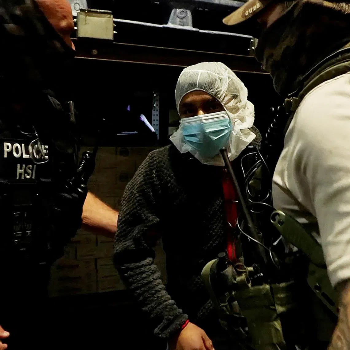 A man is detained during a raid by U.S. Immigration and Customs Enforcement (ICE) at a Glenn Valley Foods meat production plant in Omaha, Nebraska, U.S. June 10, 2025 in a still image from video.  U.S. Immigration and Customs Enforcement/Handout via REUTERS
