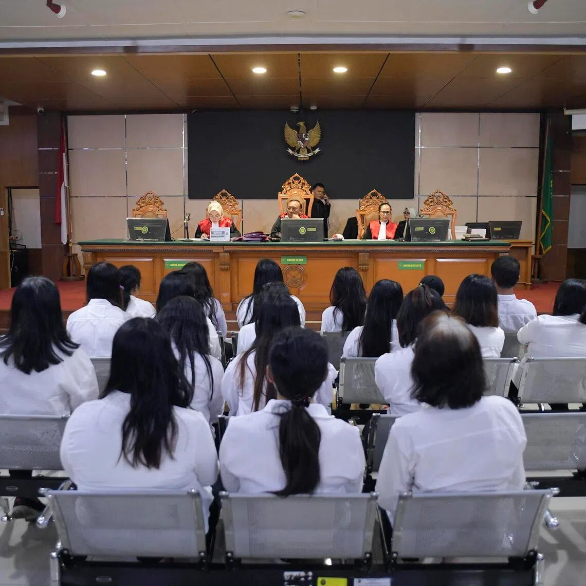 19 defendants in human trafficking syndicate during a court hearing on April 7, 2026 at the Bandung district court in West Java. 