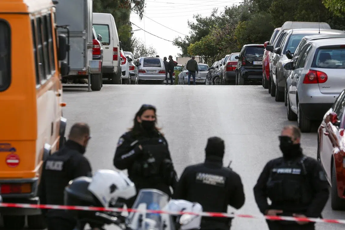 FILE PHOTO: A hearse is seen on the road where Greek journalist George Karaivaz was fatally shot in the Alimos suburb of Athens, Greece, April 9, 2021. REUTERS/Costas Baltas/File Photo