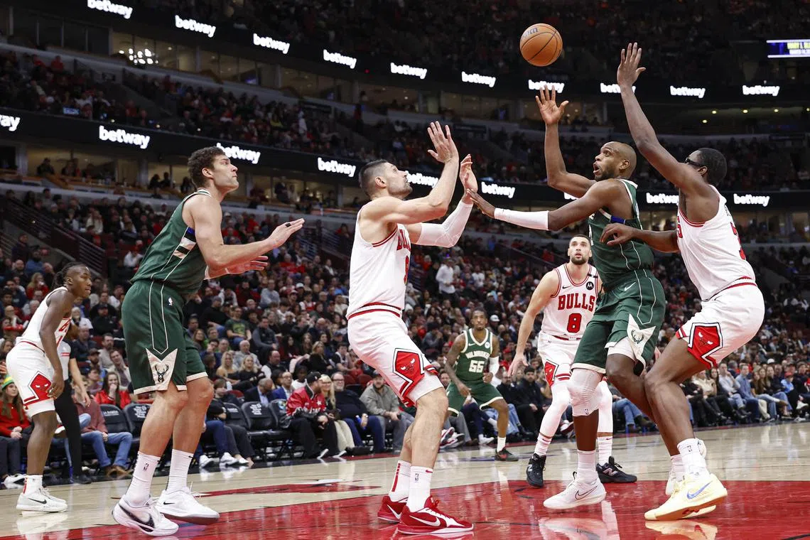 Milwaukee Bucks forward Khris Middleton shoots against the Chicago Bulls during the second half at United Centre.