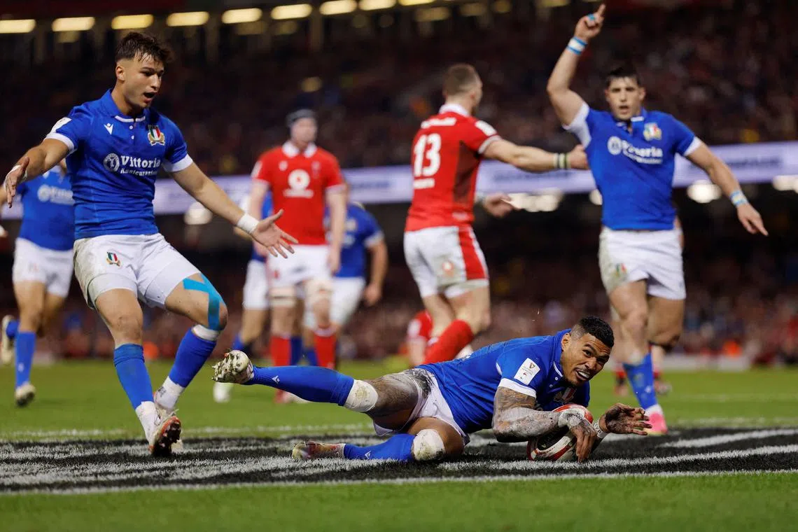 Italy's Monty Ioane scores their first try against Wales.