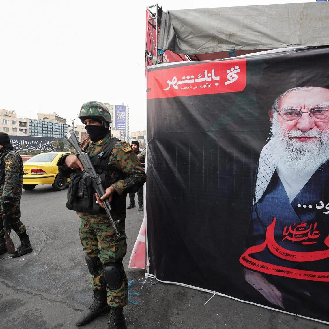Members of the police stand guard on a street in the capital, amid the US-Israeli conflict with Iran, in Tehran, Iran, on March 12, 2026.