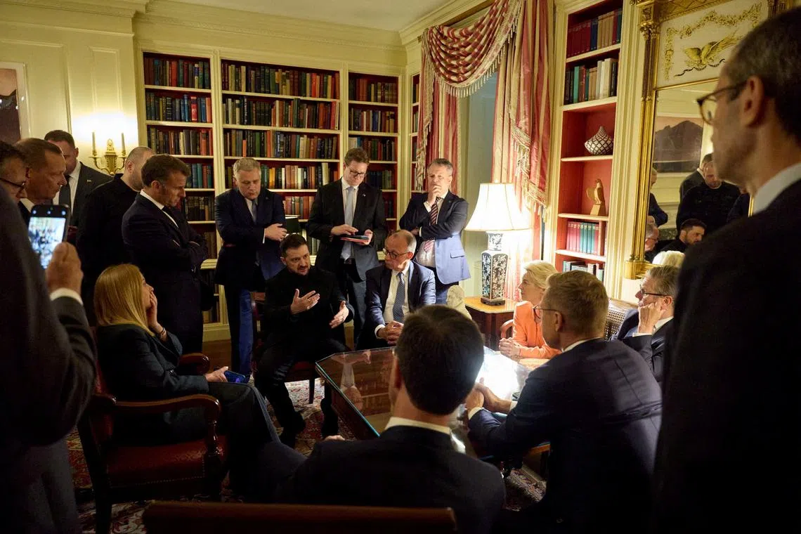 FILE PHOTO: Ukrainian President Volodymyr Zelenskiy speaks with French President Emmanuel Macron, German Chancellor Friedrich Merz, Britain's Prime Minister Keir Starmer, European Commission's President Ursula von der Leyen, Italian Prime Minister Georgia Meloni, Finland's President Alexander Stubb and NATO's Secretary General Mark Rutte, at the Ukrainian Embassy, in Washington, D.C., U.S., August 18, 2025. Ukrainian Presidential Press Service/Handout via REUTERS/File Photo