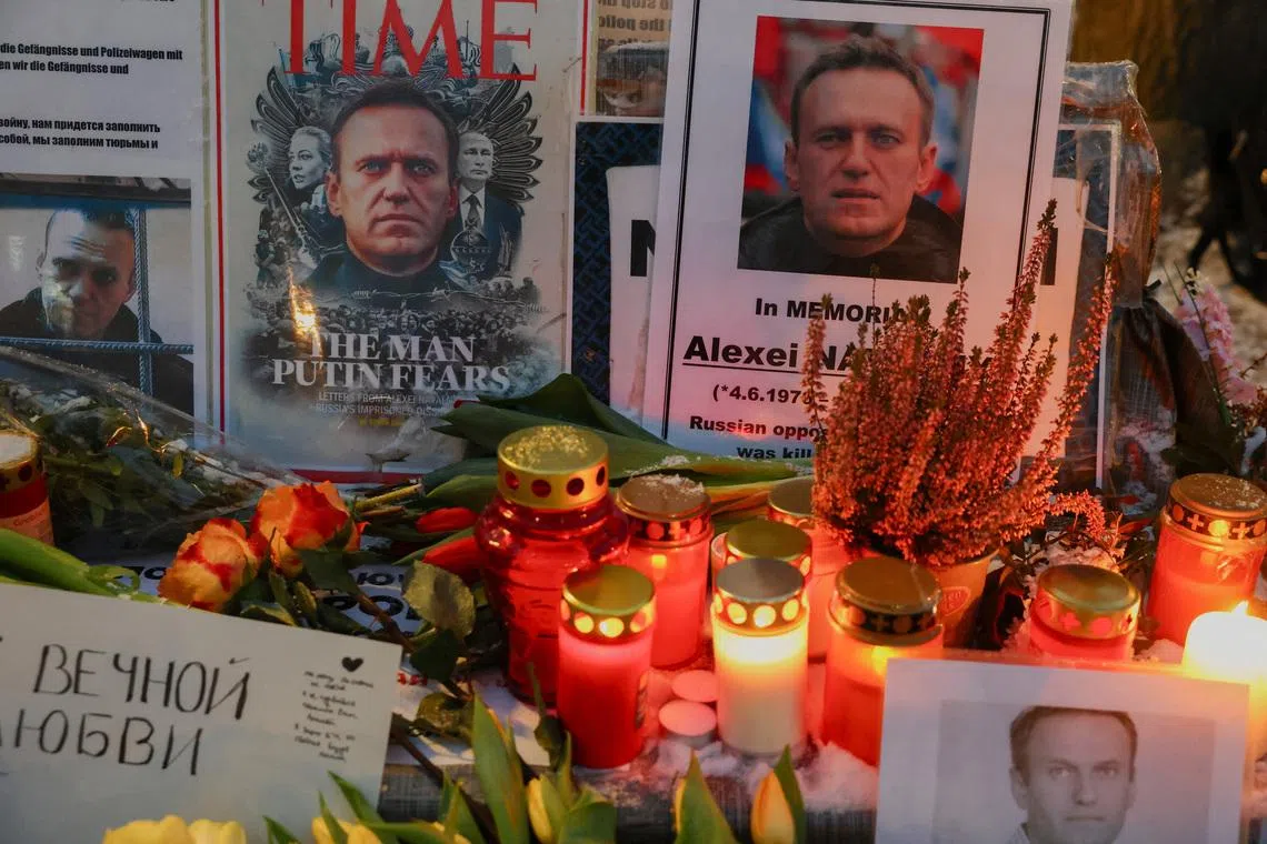 Tributes to late Kremlin critic Alexei Navalny are left outside the Russian Embassy, on the second anniversary of his death and after a joint statement from Britain, Sweden, France, Germany and The Netherlands that he was killed with Epibatidine, a toxin found in poison dart frogs in South America, in Berlin, Germany, February 16, 2026. REUTERS/Christian Mang