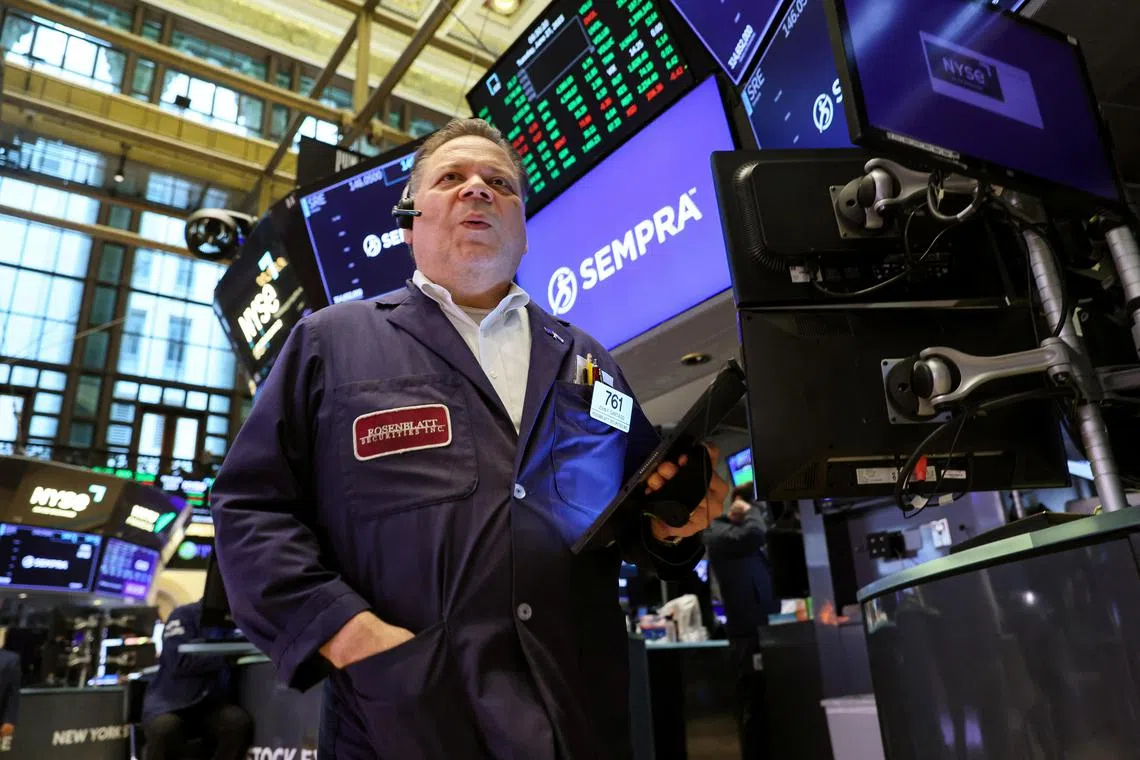 Traders work on the floor of the New York Stock Exchange, in New York City.