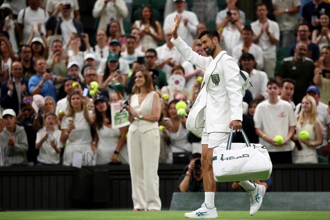 FILE PHOTO: Tennis - Wimbledon - All England Lawn Tennis and Croquet Club, London, Britain - July 1, 2026 Serbia's Novak Djokovic waves to the crowd as he leaves the court after winning his second round match against Greece's Stefanos Tsitsipas REUTERS/Marko Djurica/File Photo