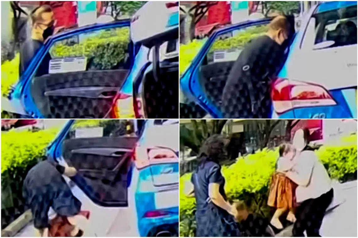 Another passenger hurriedly pulls the girl out from the backseat and both of them fall on the ground.