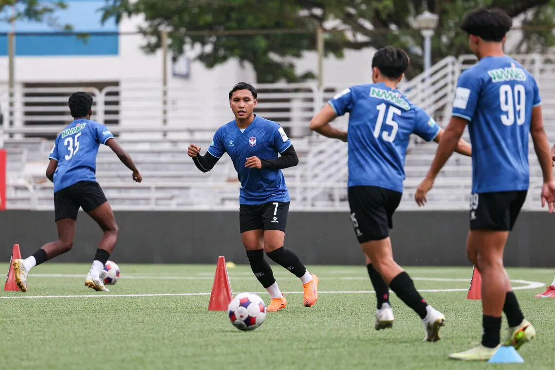 Albirex Niigata loanee Zulqarnaen Suzliman (centre) training with teammates at Jurong East Stadium on Jan 29.