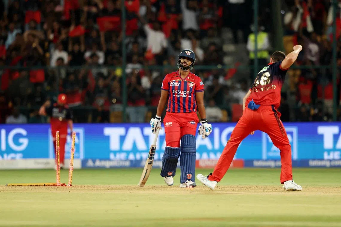 Cricket - Indian Premier League - IPL - Royal Challengers Bengaluru v Lucknow Super Giants - M. Chinnaswamy Stadium, Bengaluru, India - April 15, 2026 Lucknow Super Giants' Nicholas Pooran looks dejected after getting bowled out by Royal Challengers Bengaluru's Josh Hazlewood REUTERS/Priyanshu Singh