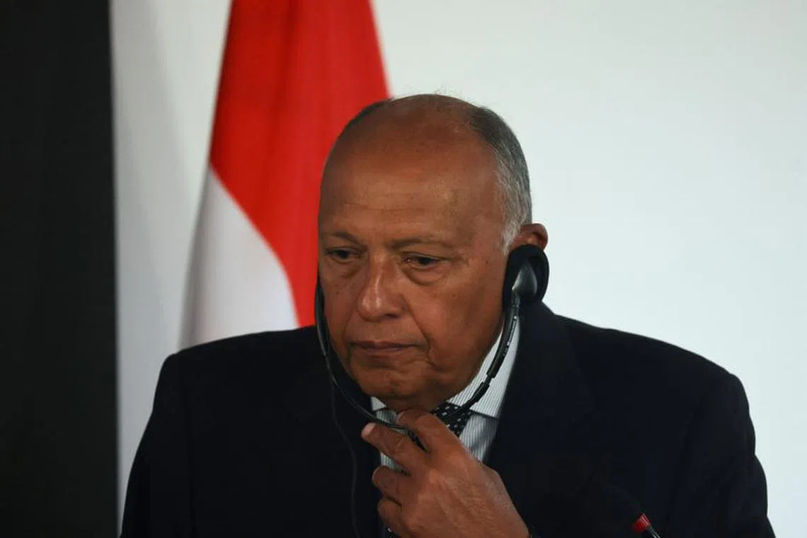 FILE PHOTO: Egyptian Foreign Minister Sameh Shoukry listens as he holds a joint press conference with French Foreign Minister Stephane Sejourne (not seen), amid the conflict between Israel and Palestinian Islamist group Hamas, at the new headquarters of the Egyptian Ministry of Foreign Affairs, at the New Administrative Capital (NAC) in the east of Cairo, Egypt February 4, 2024. REUTERS/Amr Abdallah Dalsh/ File Photo