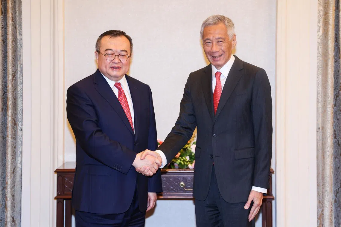 Senior Chinese diplomat Liu Jianchao (left) and PM Lee Hsien Loong expressed satisfaction that the relationship between the two countries had continued to strengthen.
