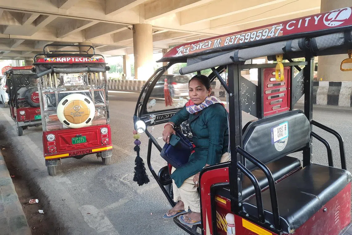 rmletter05 - Mrs Mamata Debi, 41, drives an e-rickshaw in Noida near a metro station, making 16,000 to 20,000 rupees a month. 

Photo credit: Debarshi Dasgupta