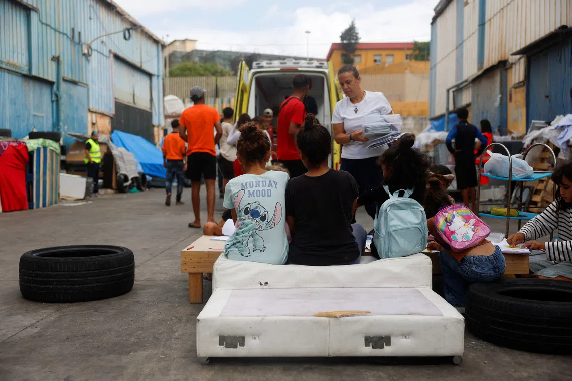 Migrant child stows away to Spain under football bus