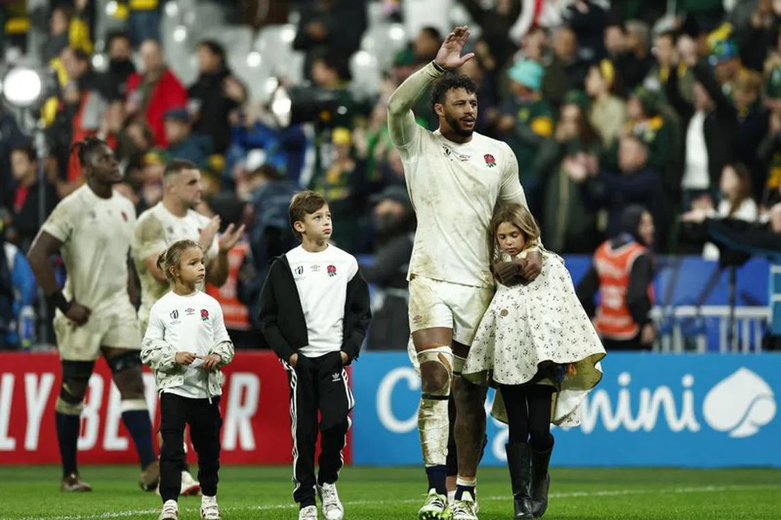 Rugby Union - Rugby World Cup 2023 - Semi Final - England v South Africa - Stade de France, Saint-Denis, France - October 21, 2023 England's Courtney Lawes with his children on the pitch after the match REUTERS/Gonzalo Fuentes