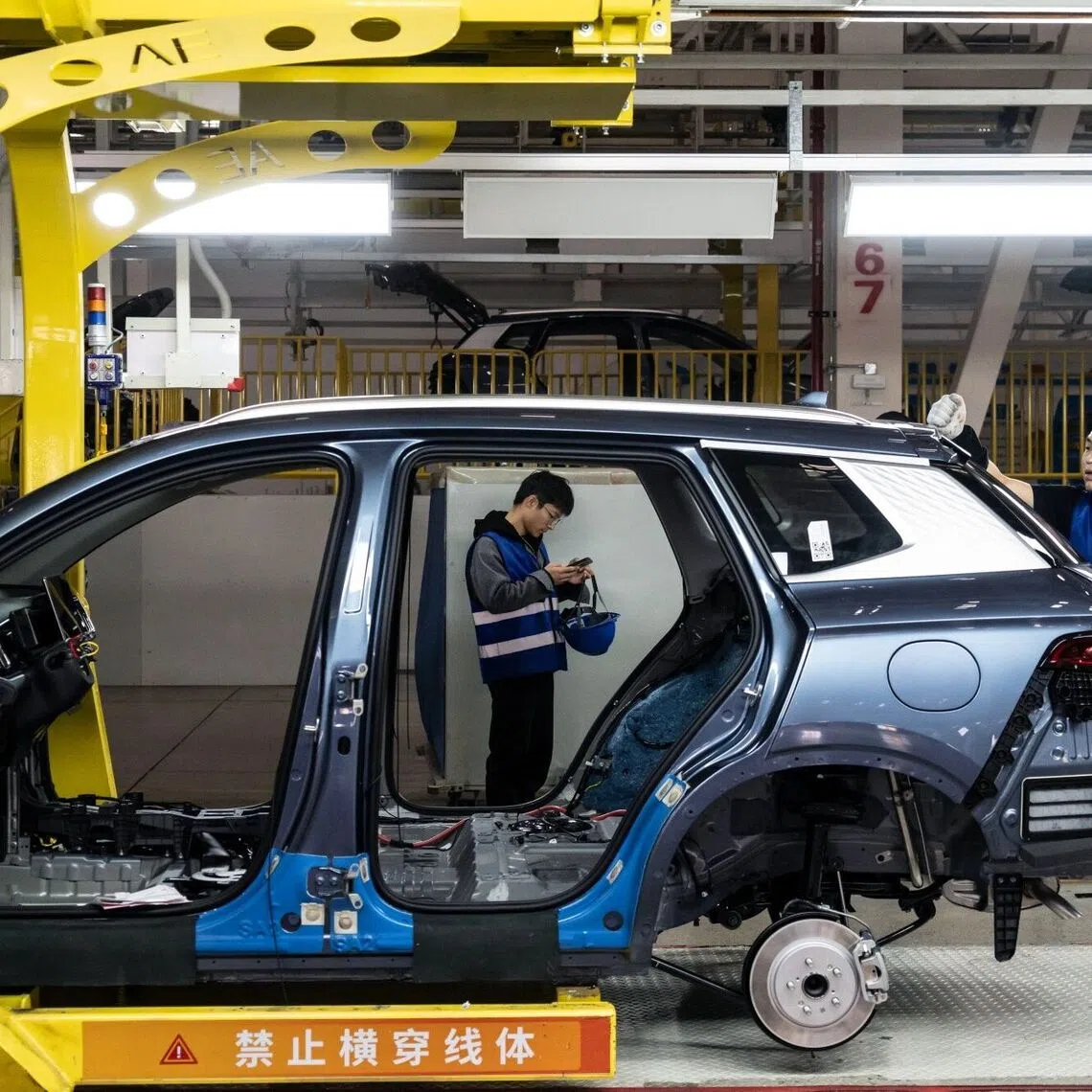 Workers at a BYD factory. Working with Chinese car and battery makers can help South-east Asian companies improve how they design and manufacture EVs.
