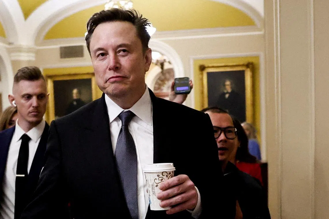 FILE PHOTO: Elon Musk walks on Capitol Hill on the day of a meeting with Senate Republican Leader-elect John Thune (R-SD), in Washington, U.S. December 5, 2024. REUTERS/Benoit Tessier/File Photo