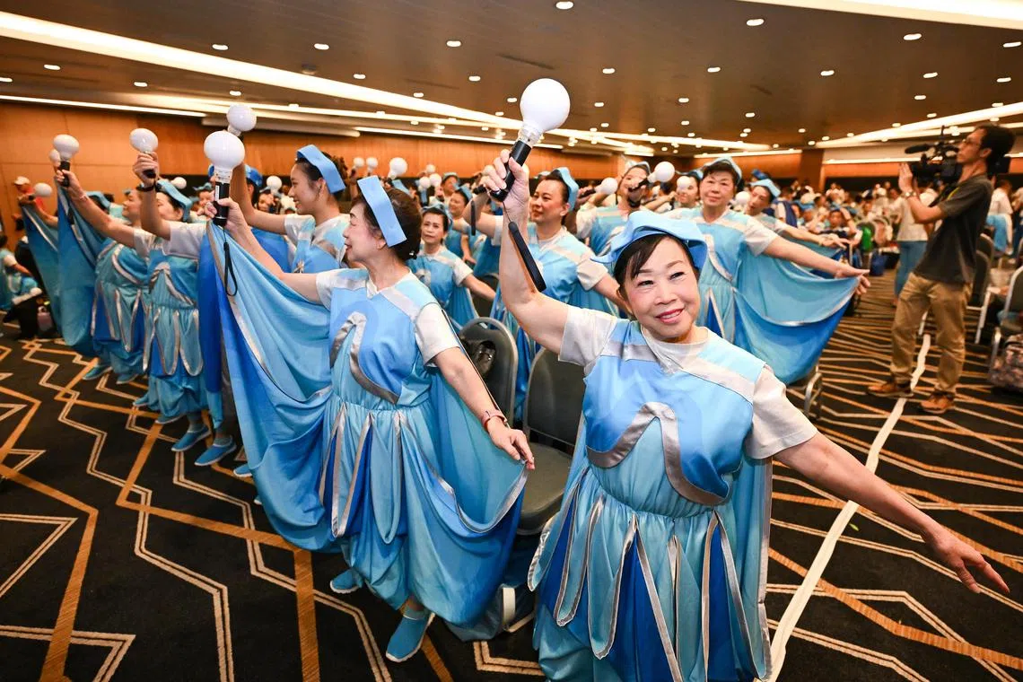 Ms Jade Koo Ah Mui (right), 70, rehearses alongside other performers from SOKA Gakkai, a local religious organisation.