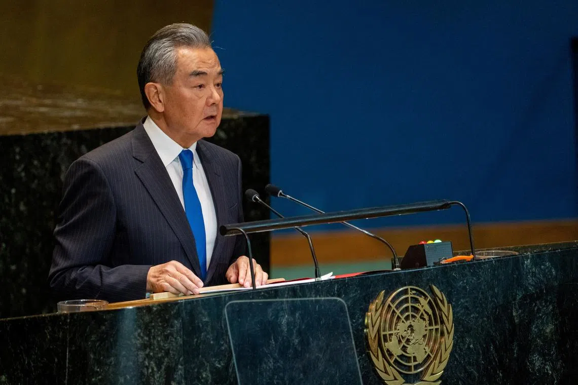 Foreign Minister of the People's Republic of China Wang Yi addresses the \"Summit of the Future\" in the General Assembly hall at United Nations headquarters in New York City, U.S., September 23, 2024. REUTERS/David Dee Delgado