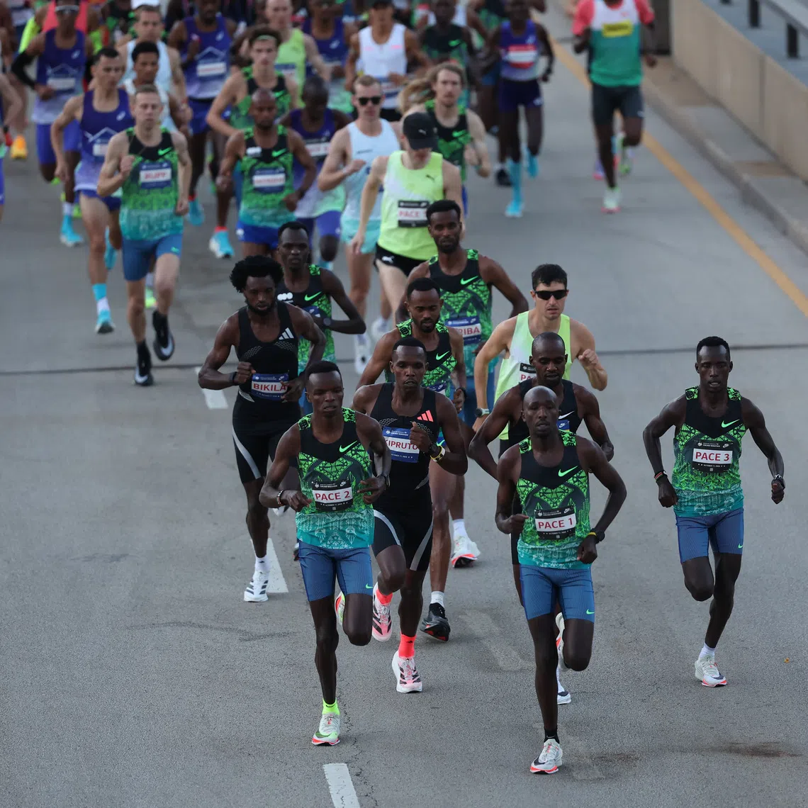 Oct 11, 2026; Chicago, IL, USA; Jacob Kiplimo of Uganda and Amos Kipruto of Kenya lead the 2026 Chicago Marathon in Grant Park. Mandatory Credit: Talia Sprague-Imagn Images