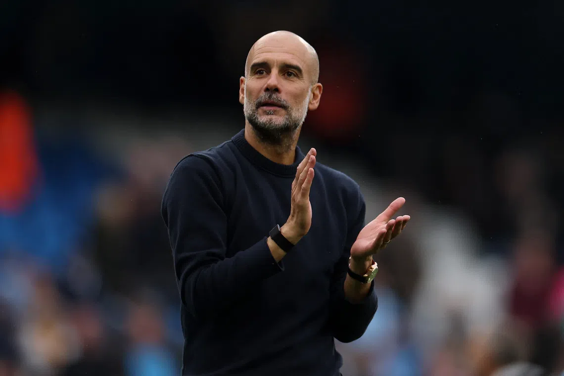 Soccer Football - Premier League - Manchester City v Burnley - Etihad Stadium, Manchester, Britain - September 27, 2025 Manchester City manager Pep Guardiola celebrates after the match REUTERS/Hannah Mckay