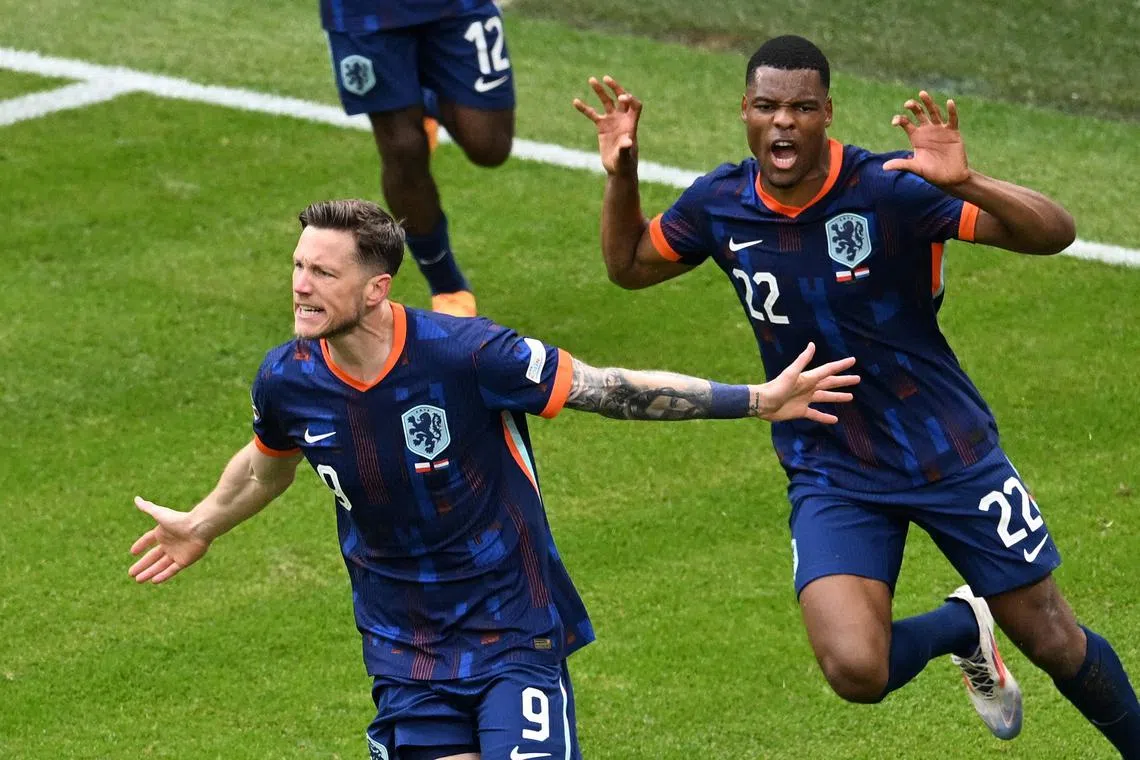 Soccer Football - Euro 2024 - Group D - Poland v Netherlands - Hamburg Volksparkstadion, Hamburg, Germany - June 16, 2024 Netherlands' Wout Weghorst celebrates scoring their second goal with Denzel Dumfries REUTERS/Carmen Jaspersen/File Photo