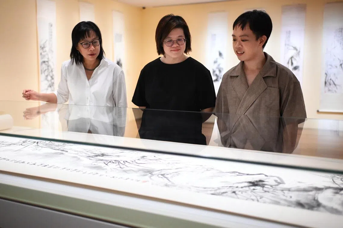 (From left) Senior curator Dr Cai Heng, curator Lim Shujuan and curatorial assistant Chee Jin Ming at the media preview of Fan Chang Tien: Rhythm of the Southern Brush at National Gallery Singapore on Oct 13.