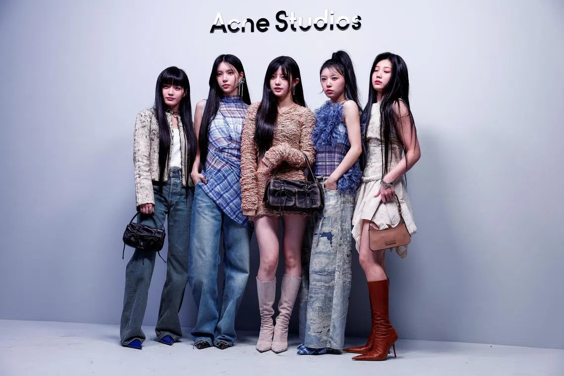 ILLIT members Yunah, Minju, Moka, Wonhee, and Iroha pose for photos on the day of a fashion show by designer Jonny Johansson as part of his Fall-Winter 2024/2025 Women's ready-to-wear collection for fashion brand Acne Studios during Paris Fashion Week in Paris, France, February 28, 2024. REUTERS/Gonzalo Fuentes