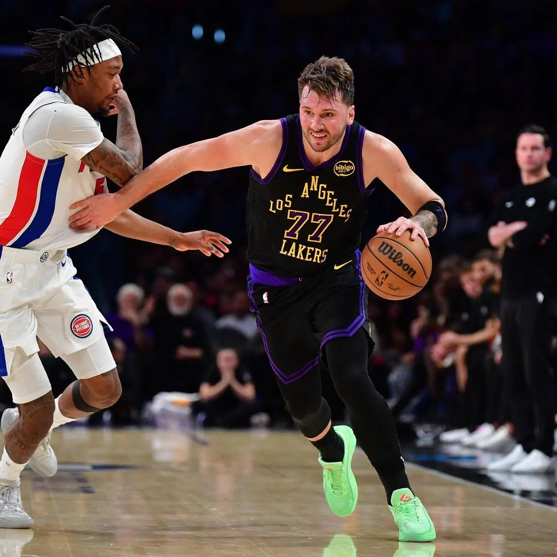 Los Angeles Lakers guard Luka Doncic moves the ball against Detroit Pistons forward Ronald Holland during the second half at Crypto.com Arena. 