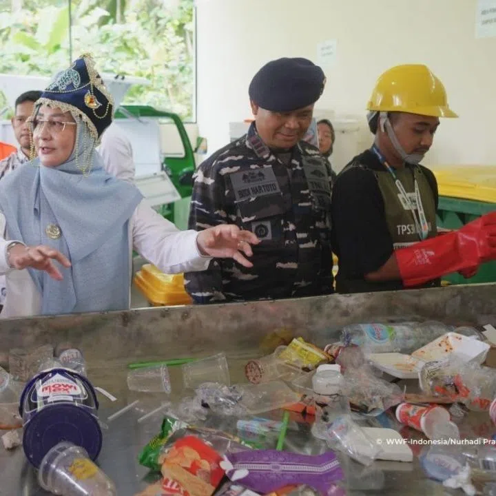 Visitors at the inauguration of a waste-sorting facility on Derawan Island, East Kalimantan, on Feb 11.