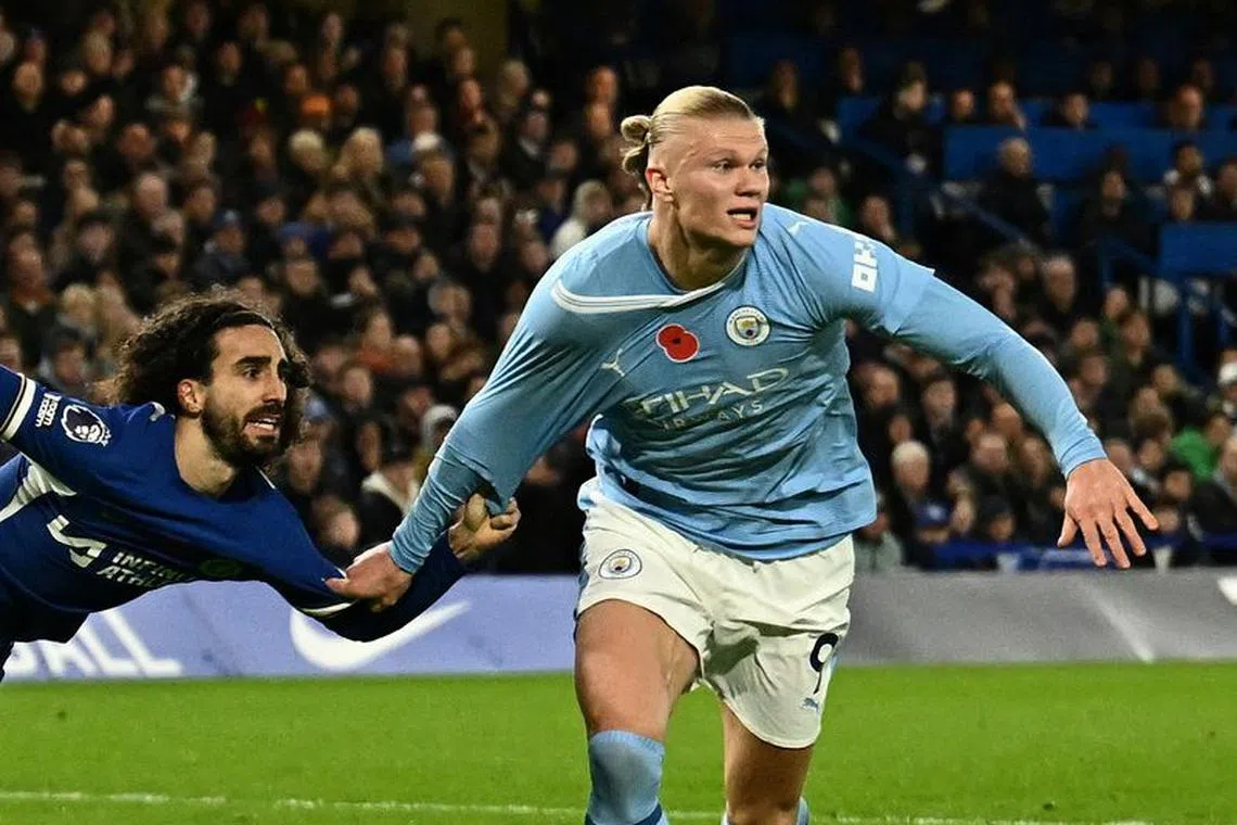 FILE PHOTO: Soccer Football - Premier League - Chelsea v Manchester City - Stamford Bridge, London, Britain - November 12, 2023 Chelsea's Marc Cucurella fouls Manchester City's Erling Braut Haaland to concede a penalty REUTERS/Dylan Martinez/File Photo