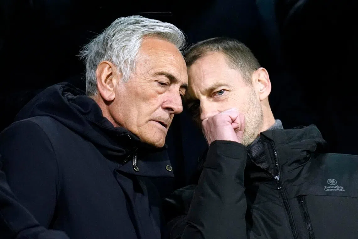 UEFA vice-president and head of Italy’s football federation Gabriele Gravina (left) and UEFA president Aleksander Ceferin in the stands before the 2026 World Cup play-off between Italy and Bosnia and Herzegovina at Bilino Polje Stadium in Zenica on March 31, 2026. Italy lost 4-1 on penalties after the match ended 1-1.