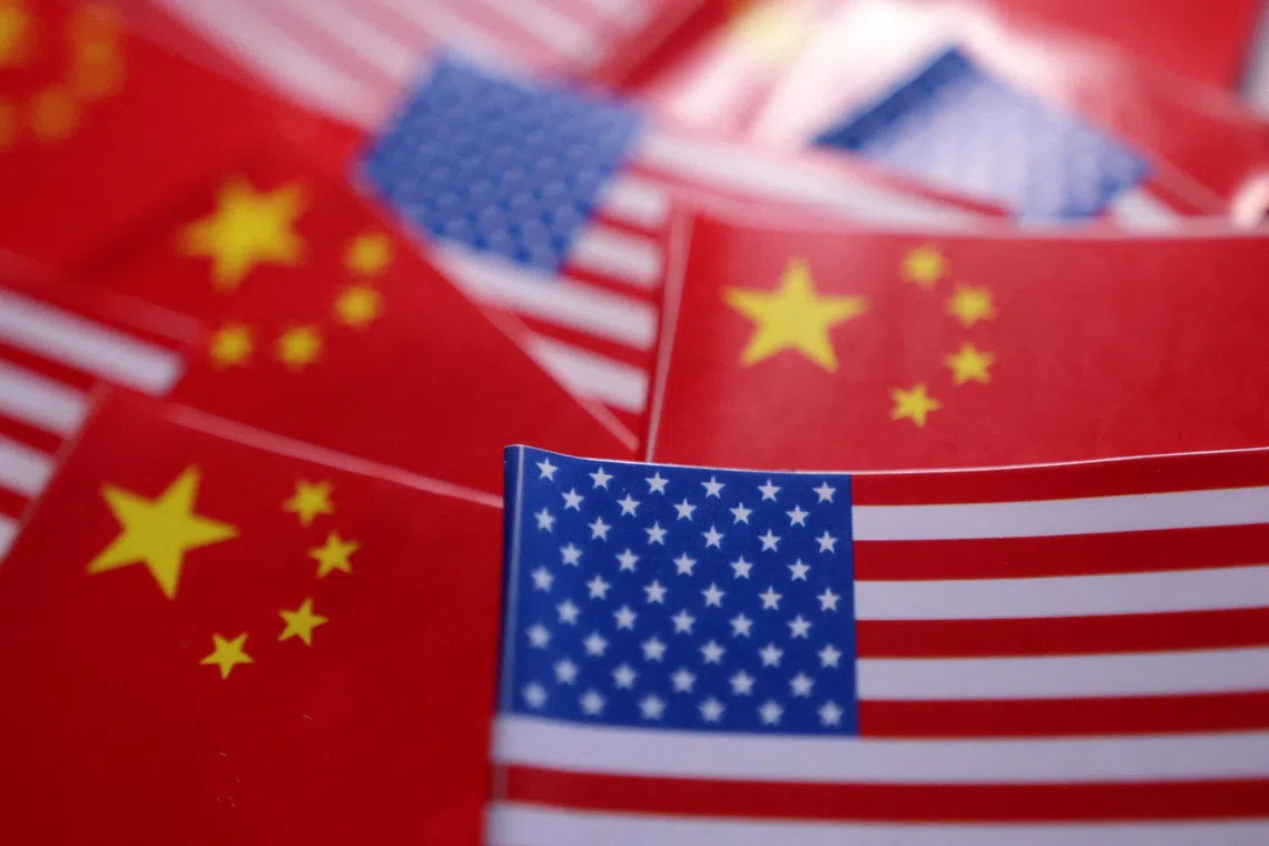 FILE PHOTO: U.S. and Chinese flags are seen in this illustration taken March 20, 2025. REUTERS/Dado Ruvic/Illustration/File Photo
