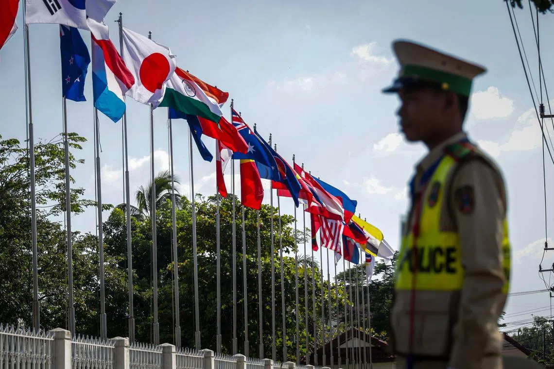 Asean country flags with security personnel at the Foreign Media Centre taken on Oct 7 ahead of the 44th and 45th ASEAN Summits and Related Summits.