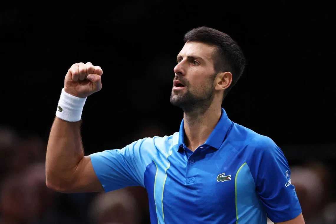Novak Djokovic of Serbia overcomes Bulgaria's Grigor Dimitrov to win the Paris Masters on Sunday.