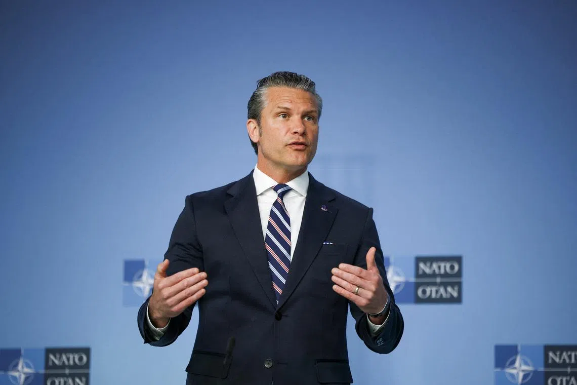 U.S. Defense Secretary Pete Hegseth talks to the media on the day of a meeting of NATO defence ministers at the alliance's headquarters in Brussels, Belgium, June 18, 2026. REUTERS/Stoyan Nenov