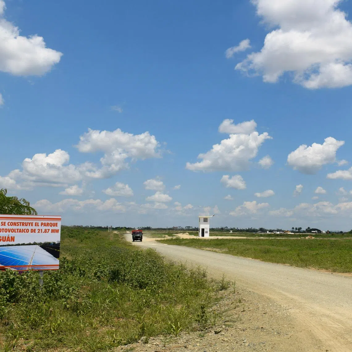 A banner announces the construction of a photovoltaic solar farm in Cabaiguan, Cuba May 21, 2025. REUTERS/Norlys Perez