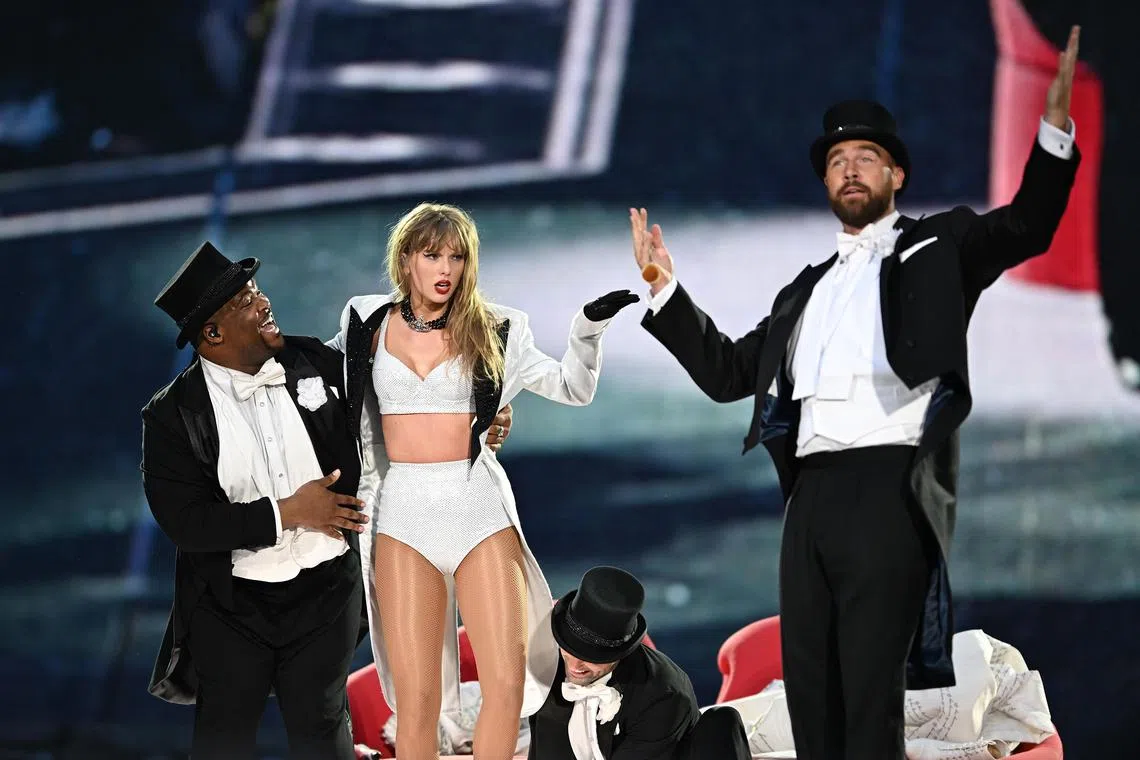 Taylor Swift is joined on stage by Travis Kelce (right) during The Eras Tour at Wembley Stadium in London, England, on June 23, 2024.