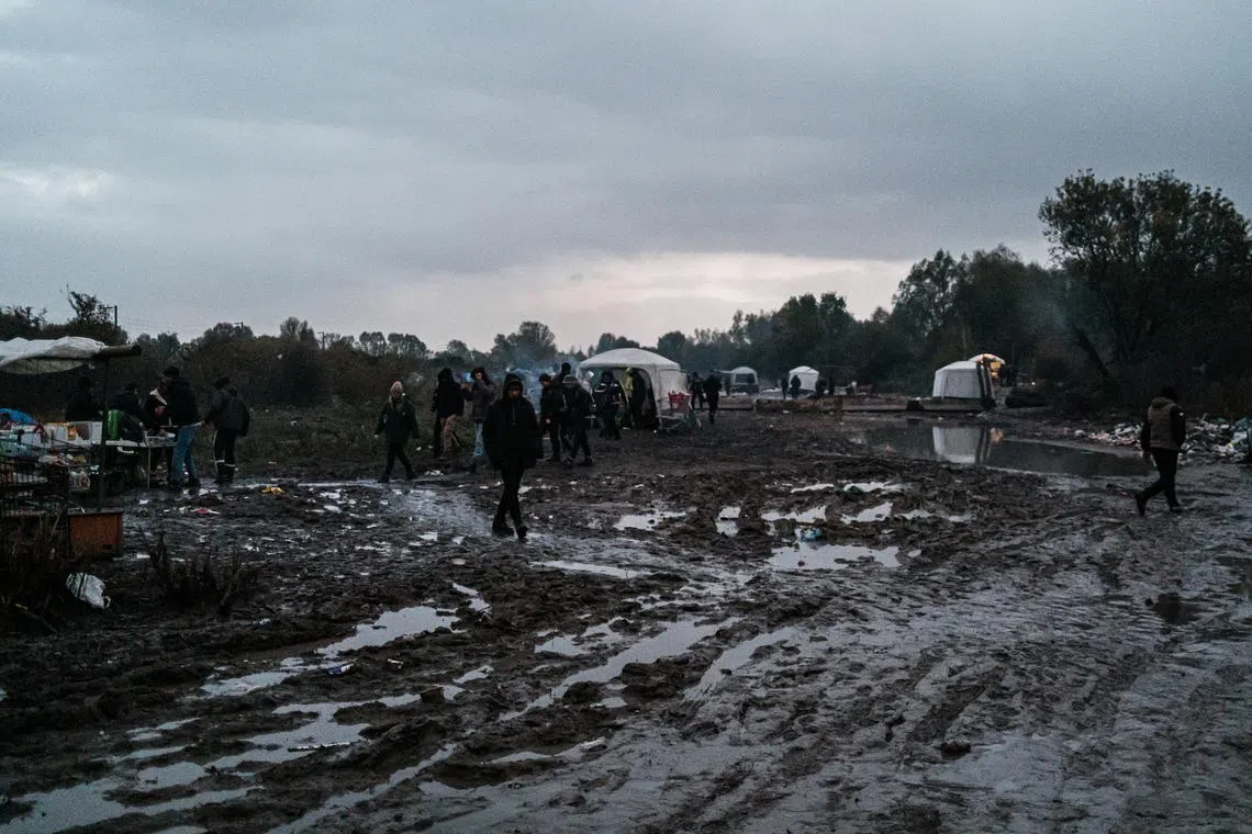 At Loon-Plage, near Grande-Synthe, a camp with hundreds of refugees awaiting their crossing on mud-filled terrain with extremely difficult conditions (Photo by Jerome Gilles/NurPhoto)NO USE FRANCE https://www.reutersconnect.com/all?id=tag%3Areuters.com%2C2022%3Anewsml_MT1NURPHO0005L5XG0&share=true