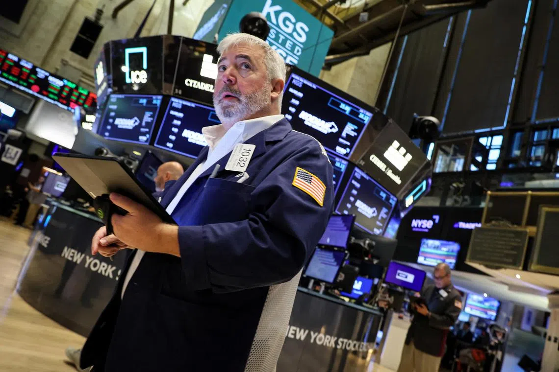 Traders work on the floor of the New York Stock Exchange, in New York City.    