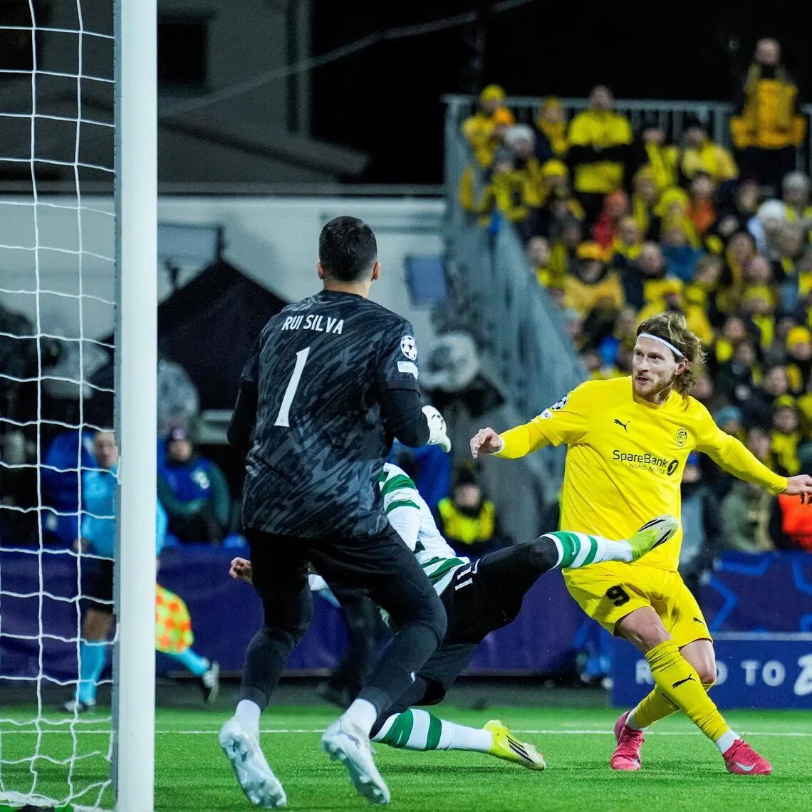 Bodo/Glimt's Kasper Hogh scores their third goal against Sporting Lisbon.