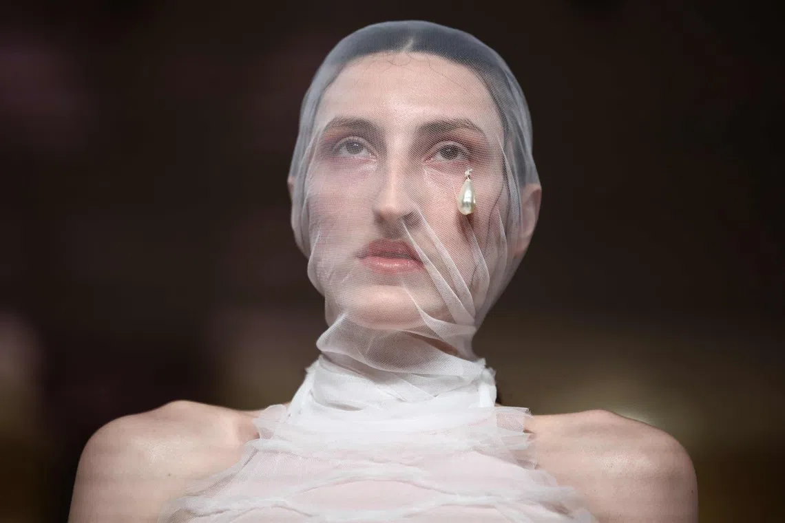 TOPSHOT - A model displays a creation from the DI PETSA Spring/Summer 2027 collection at London Fashion Week in London on September 21, 2026. (Photo by Henry NICHOLLS / AFP)