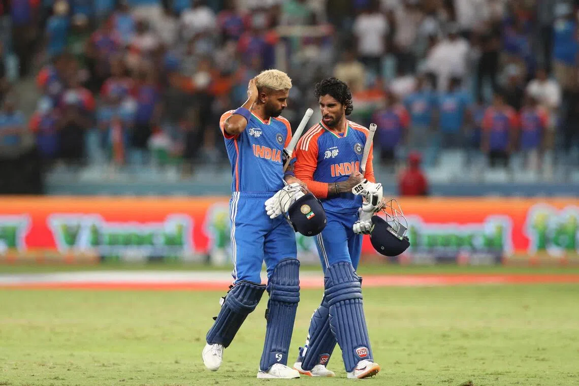 India's Hardik Pandya and Tilak Varma celebrate after the match.
