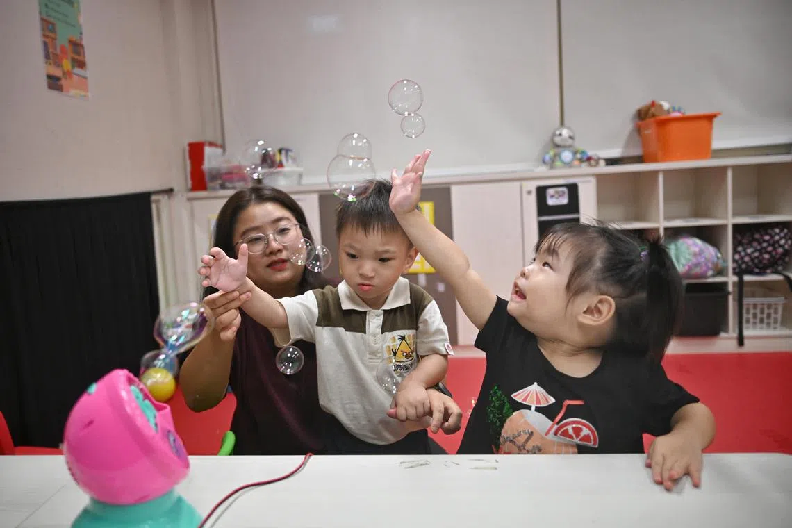 Cheryl Chia, 28, occupational therapist at AWWA with clients at AWWA Early Intervention Centre @ Fernvale Link on Feb 21, 2024.