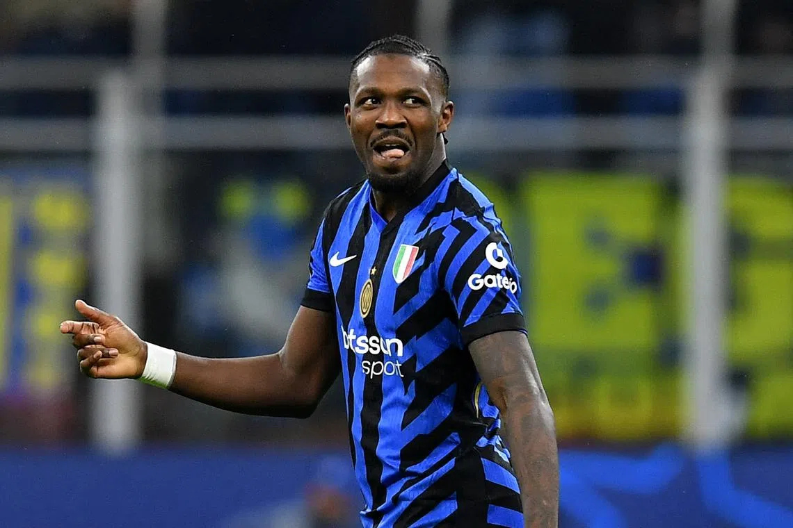 Soccer Football - Champions League - Round of 16 - Second Leg - Inter Milan v Feyenoord - San Siro, Milan, Italy - March 11, 2025 Inter Milan's Marcus Thuram celebrates scoring their first goal REUTERS/Jennifer Lorenzini
