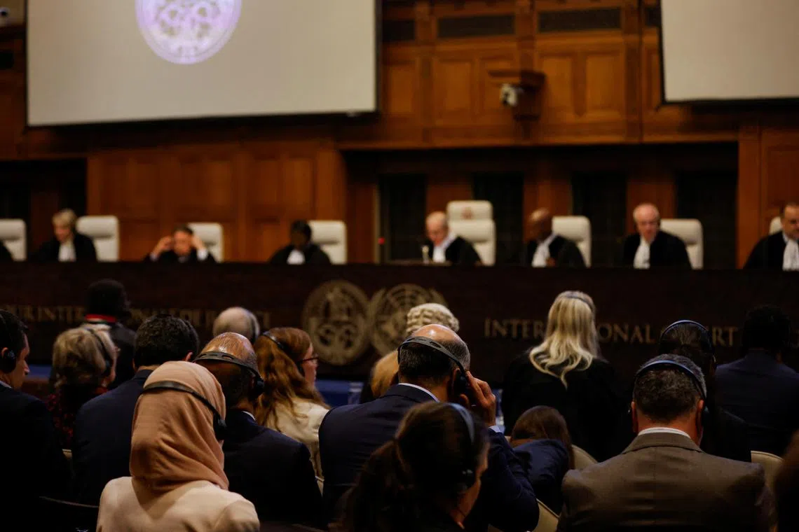 Delegates attend a ruling on South Africa's request to order a halt to Israel's Rafah offensive in Gaza as part of a larger case brought before the Hague-based court by South Africa accusing Israel of genocide, at the International Court of Justice (ICJ), in The Hague, Netherlands May 24, 2024. REUTERS/Johanna Geron