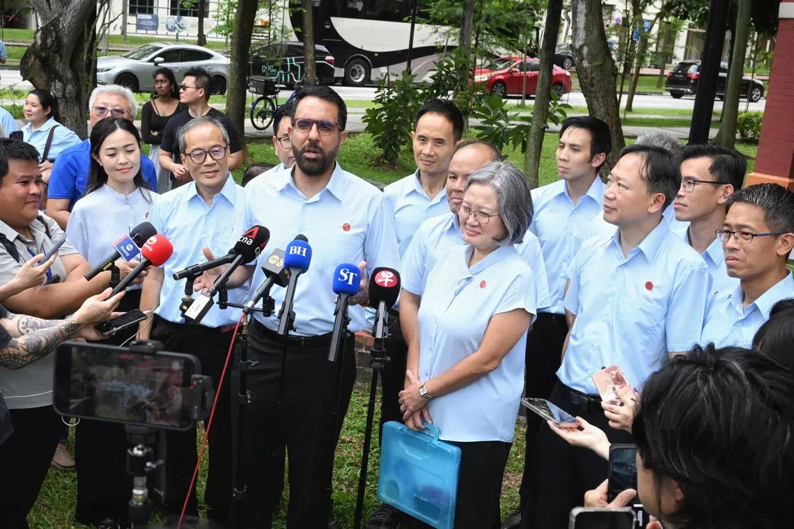 WP chief Pritam Singh speaking to reporters after submitting nomination papers for the Aljunied GRC team at the Poi Ching School nomination centre on April 23.