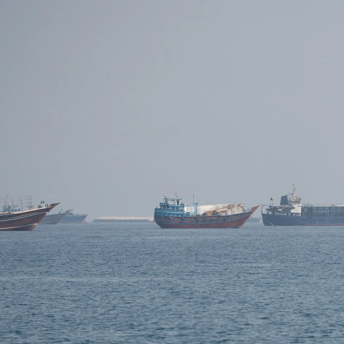 Vessels near the Strait of Hormuz, as seen from Musandam, Oman, August 24, 2026. REUTERS/Stringer