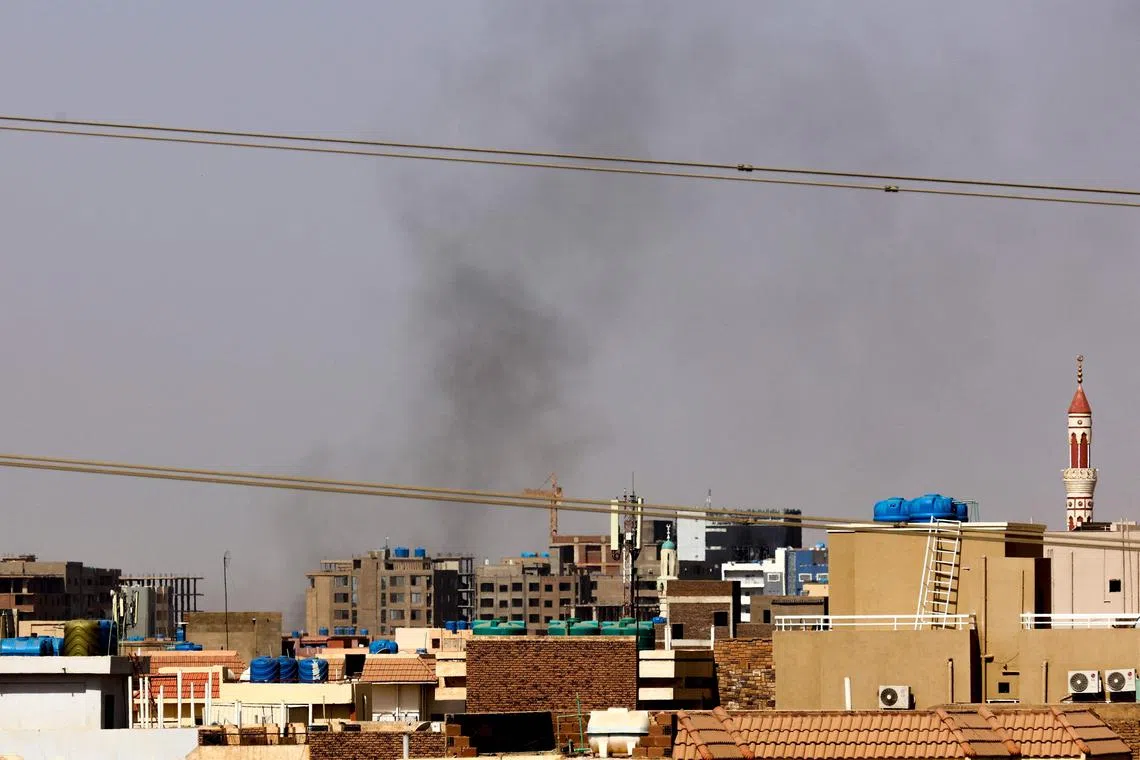 Smoke billows over residential buildings in eastern Khartoum during ongoing battles on April 22, 2023.